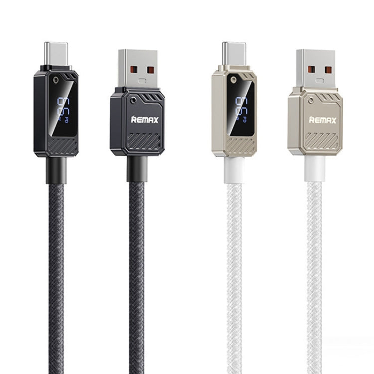 Two Remax USB cables, one black and one white, on a white background.