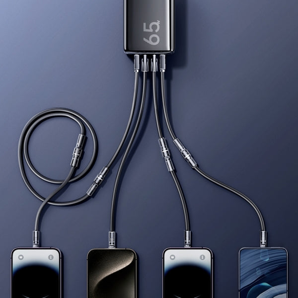 Multiple smartphones connected to a charging cable with a power adapter on a dark blue background
